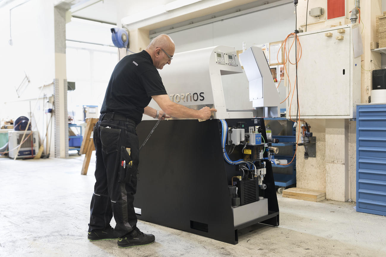 An employee of Swiss machine tool producer Tornos in Moutier, canton Bern