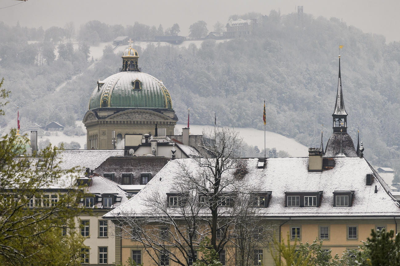 Snow on rooftops in Swiss capital Bern