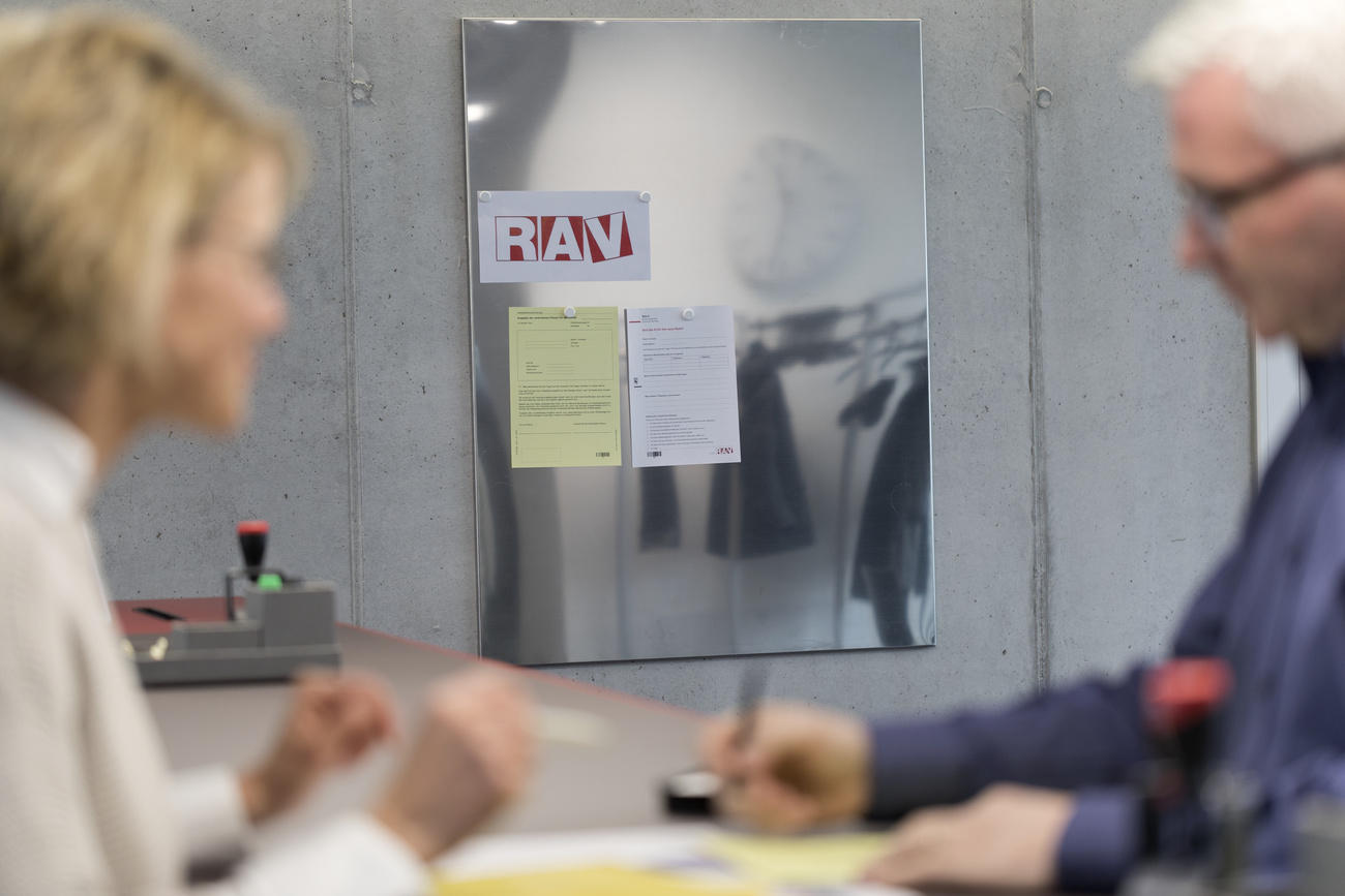At the reception desk of a regional Swiss employment agency
