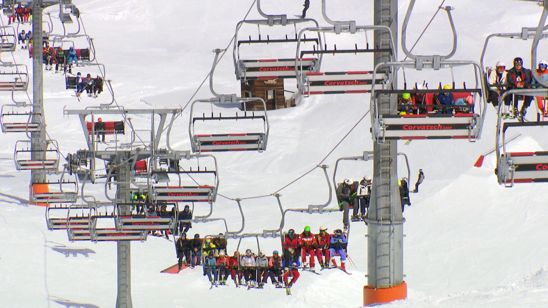 Skiers on chairlift