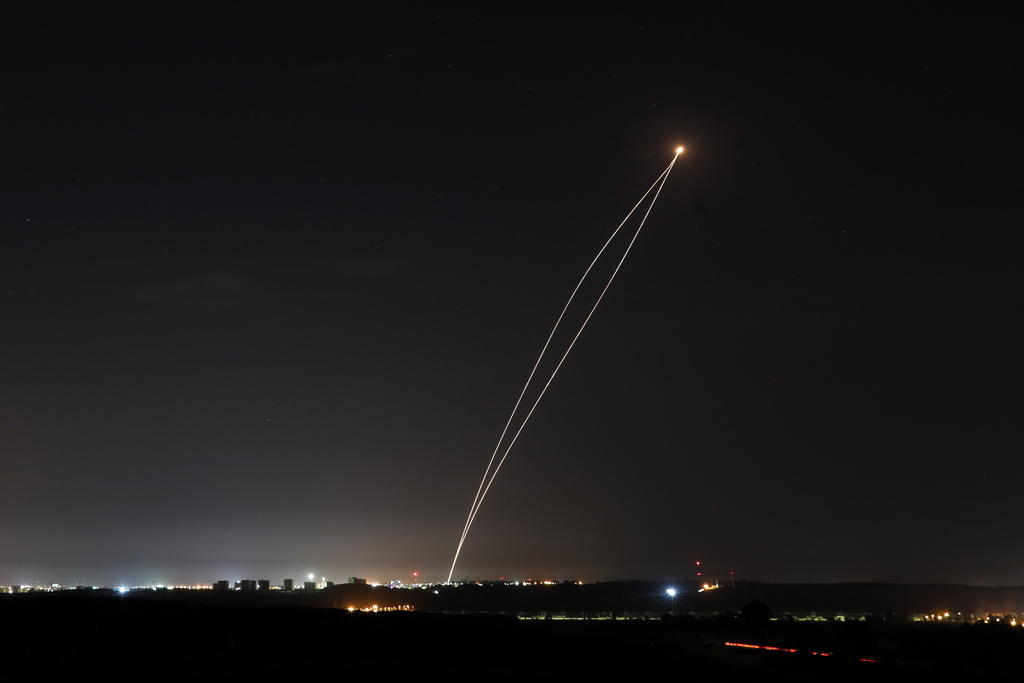 A rocket fired from Gaza is intercepted by an Israeli Iron Dome anti-missile defence system