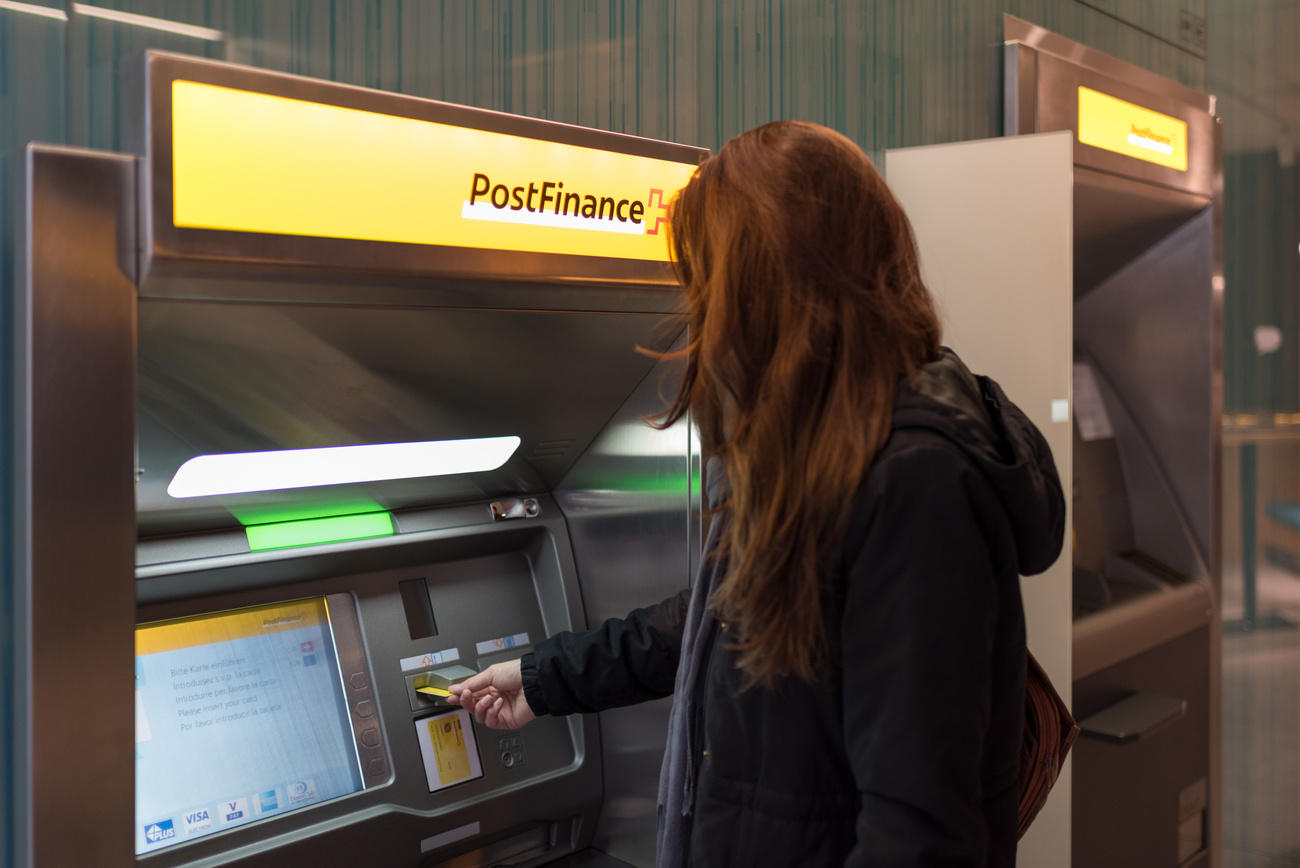 Girl at bank machine