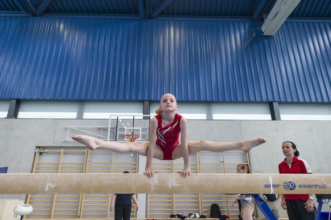 A girl performs on the bar in 2013.