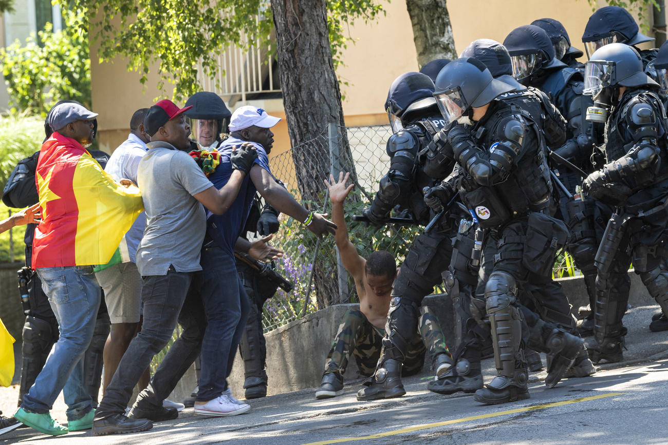 Police and Cameroonian protesters