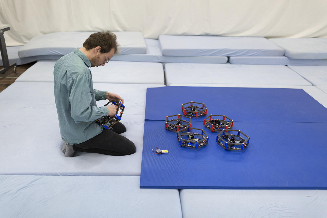 man testing drones in a lab environment