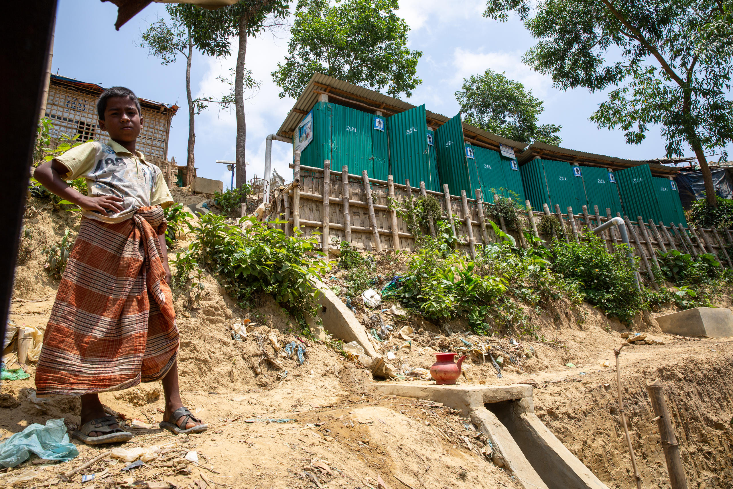 Boy in front of the latrines