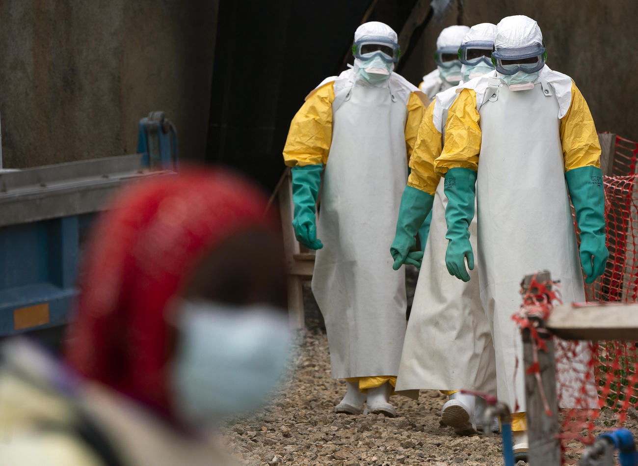 Health workers dressed in protective gear begin their shift at an Ebola treatment centre in Beni, DRC