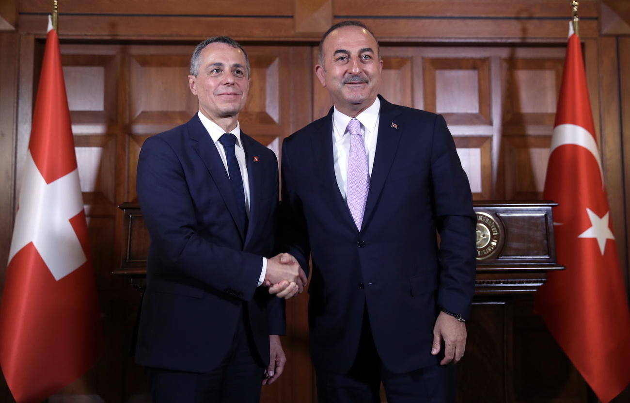 Swiss foreign minister Cassis shaking hands with his Turkish counterpart Cavusoglu
