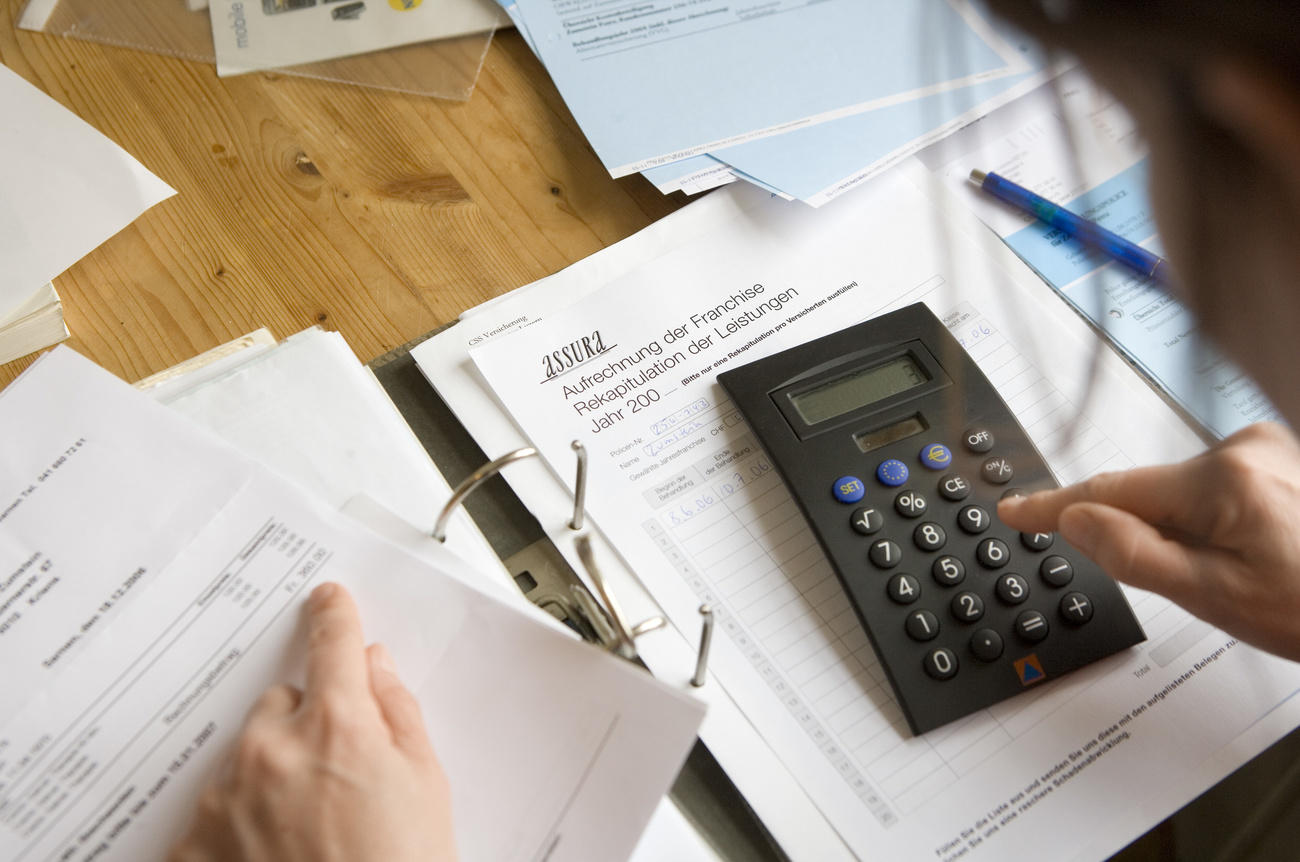 Woman calculating health insurance costs