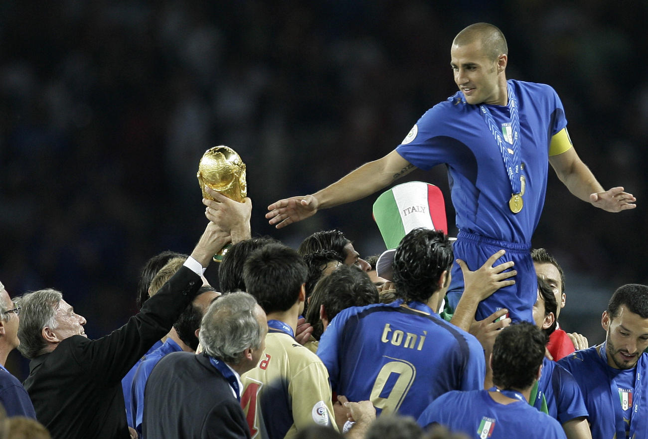 German president hands over the World Cup trophy to Italy s captain Fabio Cannavaro in 2006
