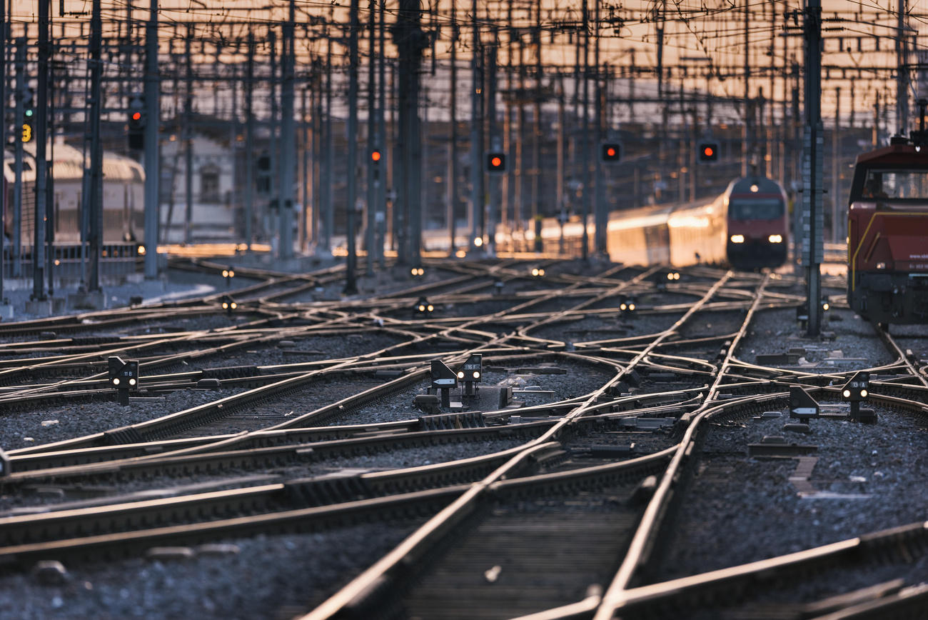 Rail tracks, signals, overhead lines, switches and a passenger train