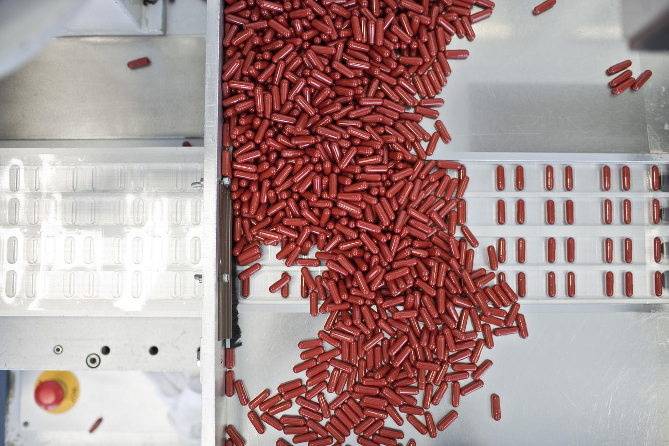 Pills being dispensed from a machine