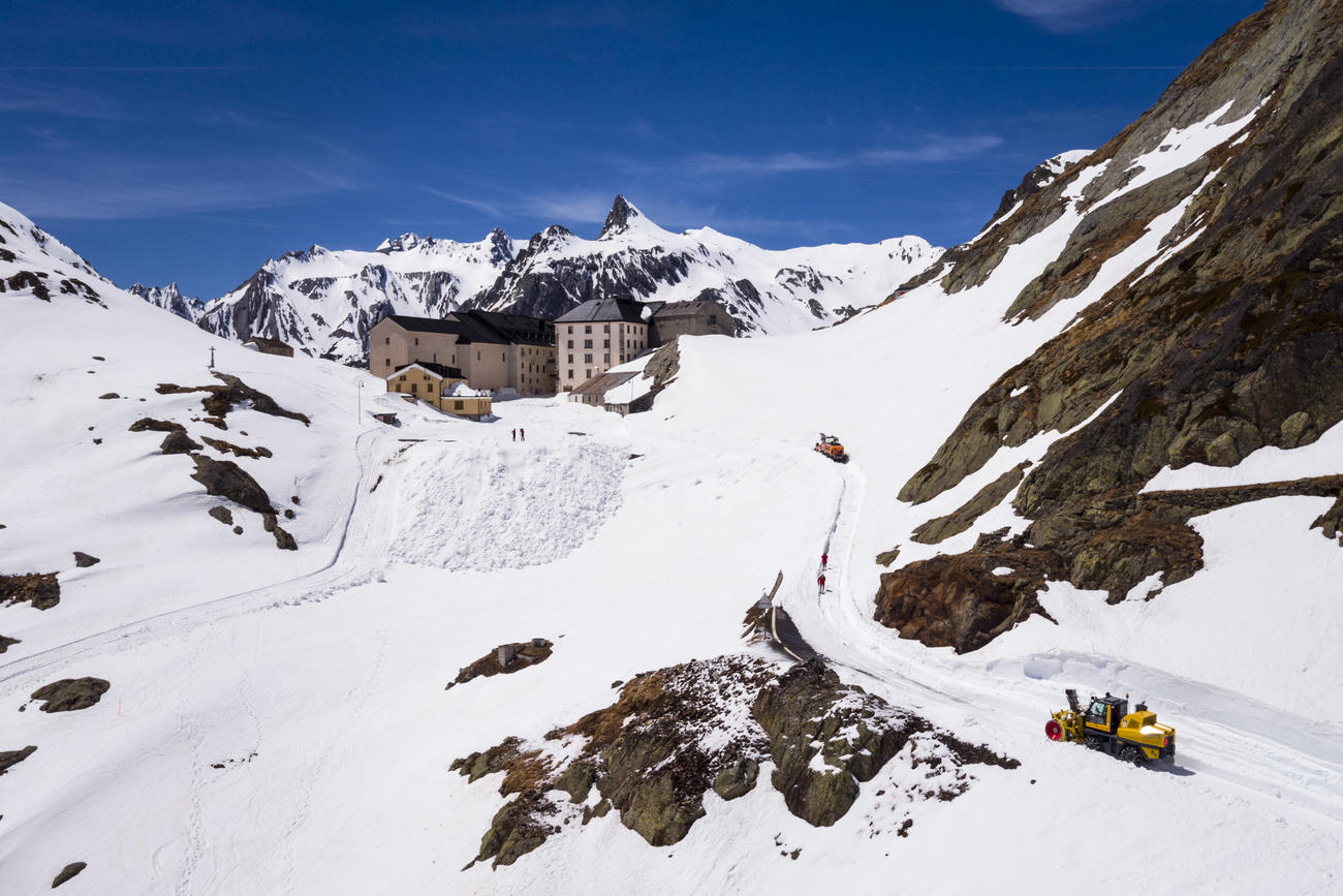 Snow capped mountain pass with hotel