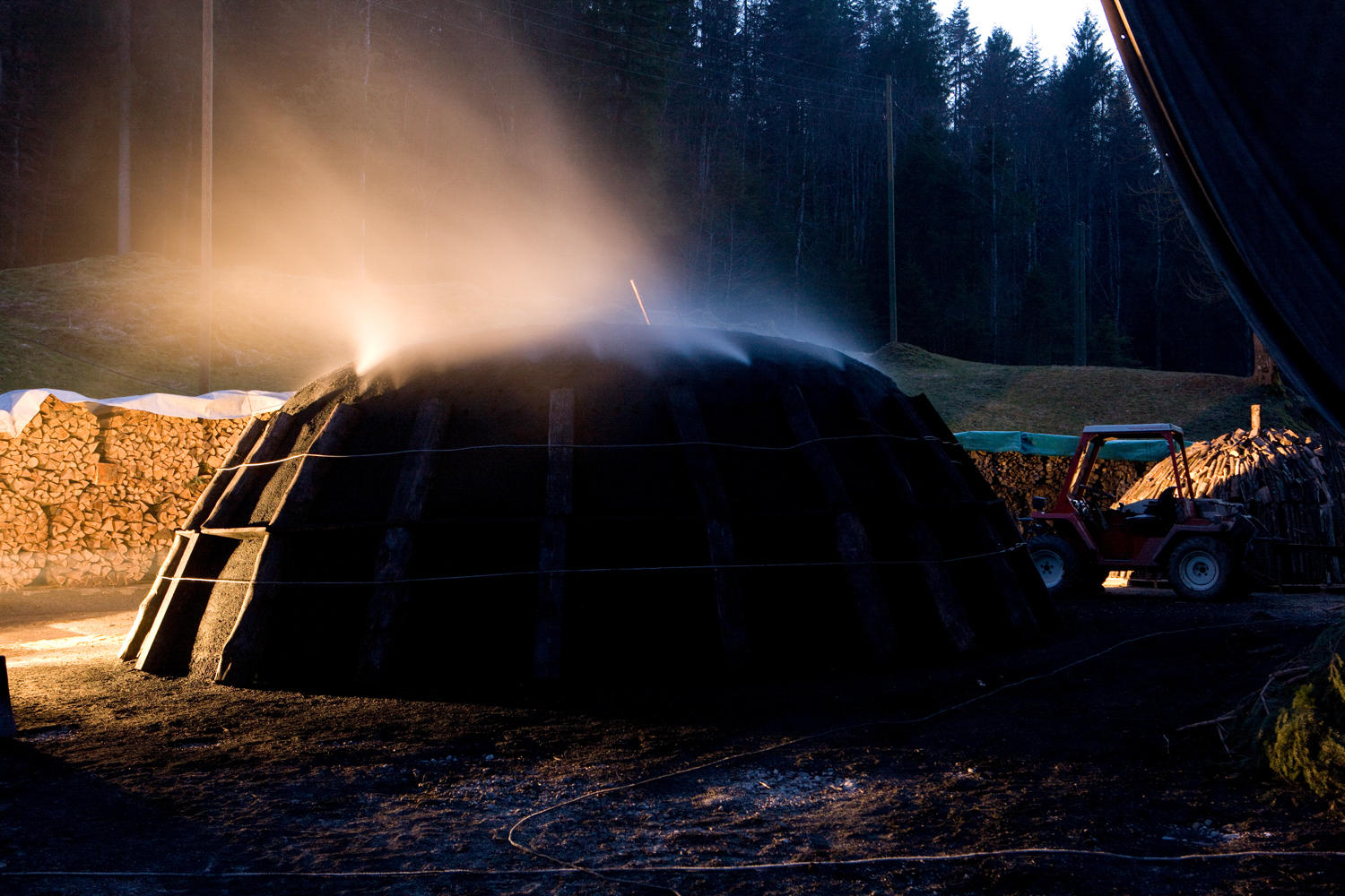 Smouldering pile at night