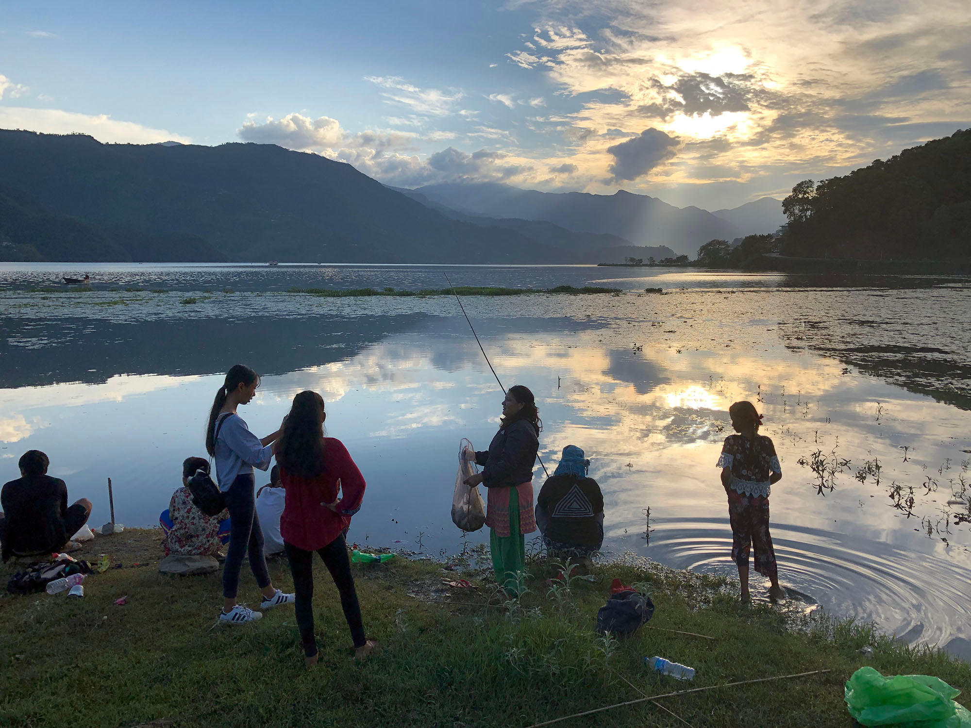 People by a lake