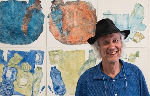 étienne krähenbühl in front of his prints