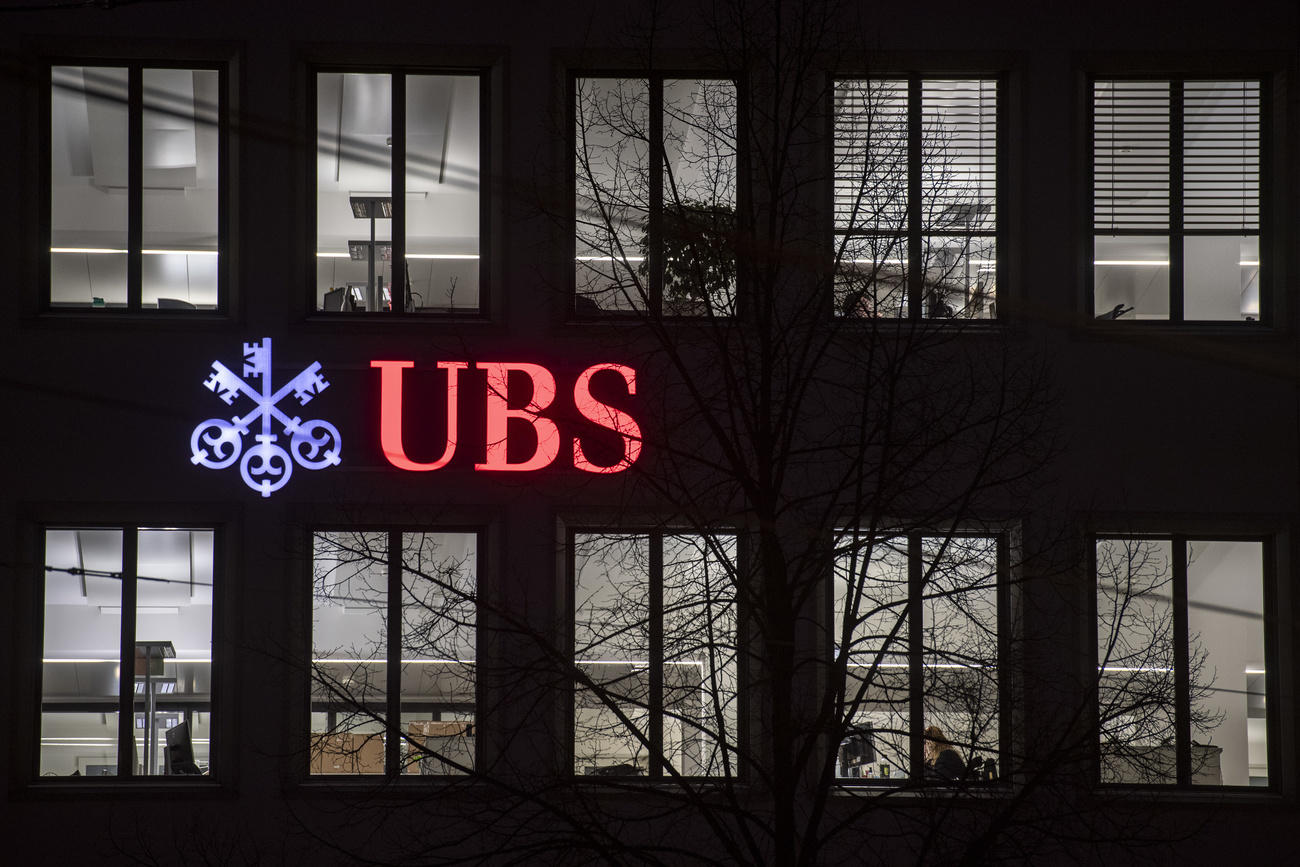 UBS sign on building in dark