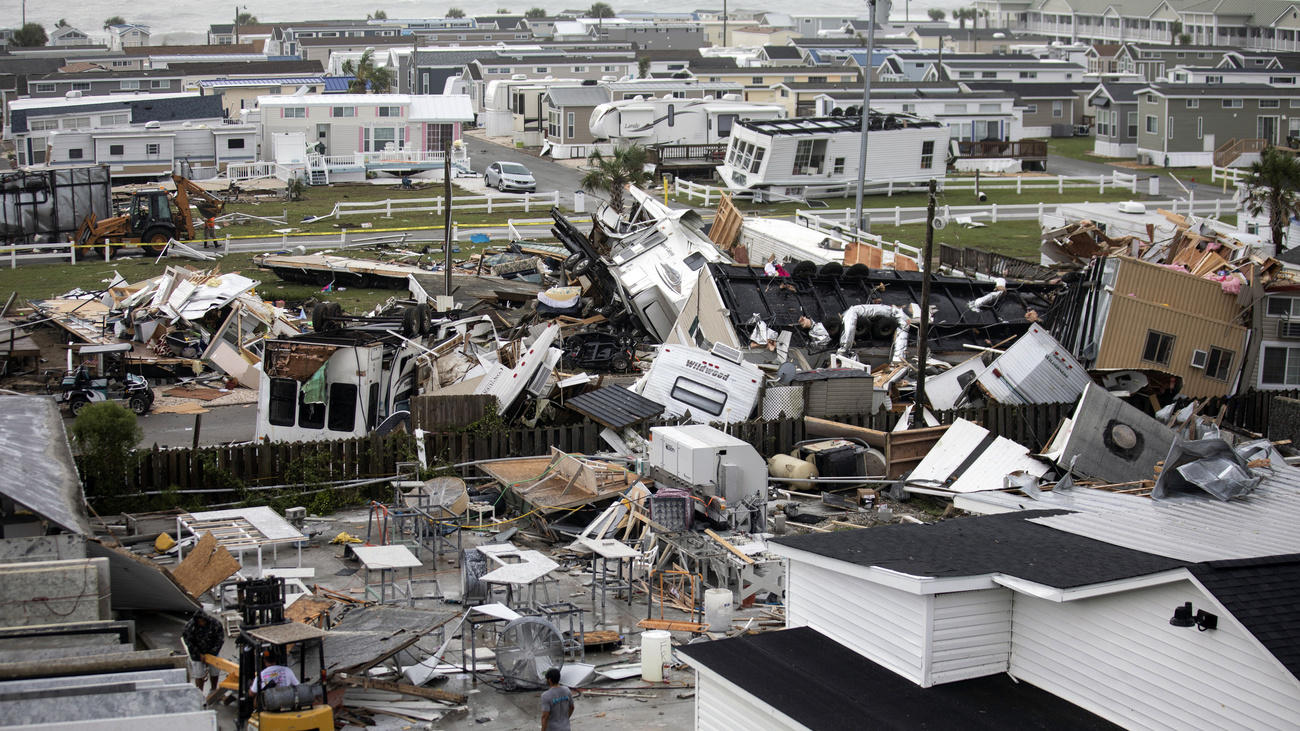 Upended mobile homes on Emerald Island