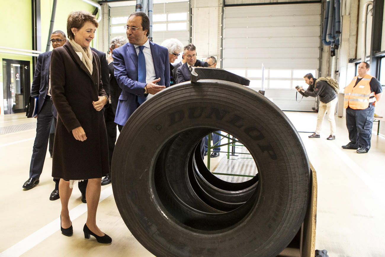 Transport Minister Sommaruga,her Moroccan counterpart Amara and a giant truck tyre