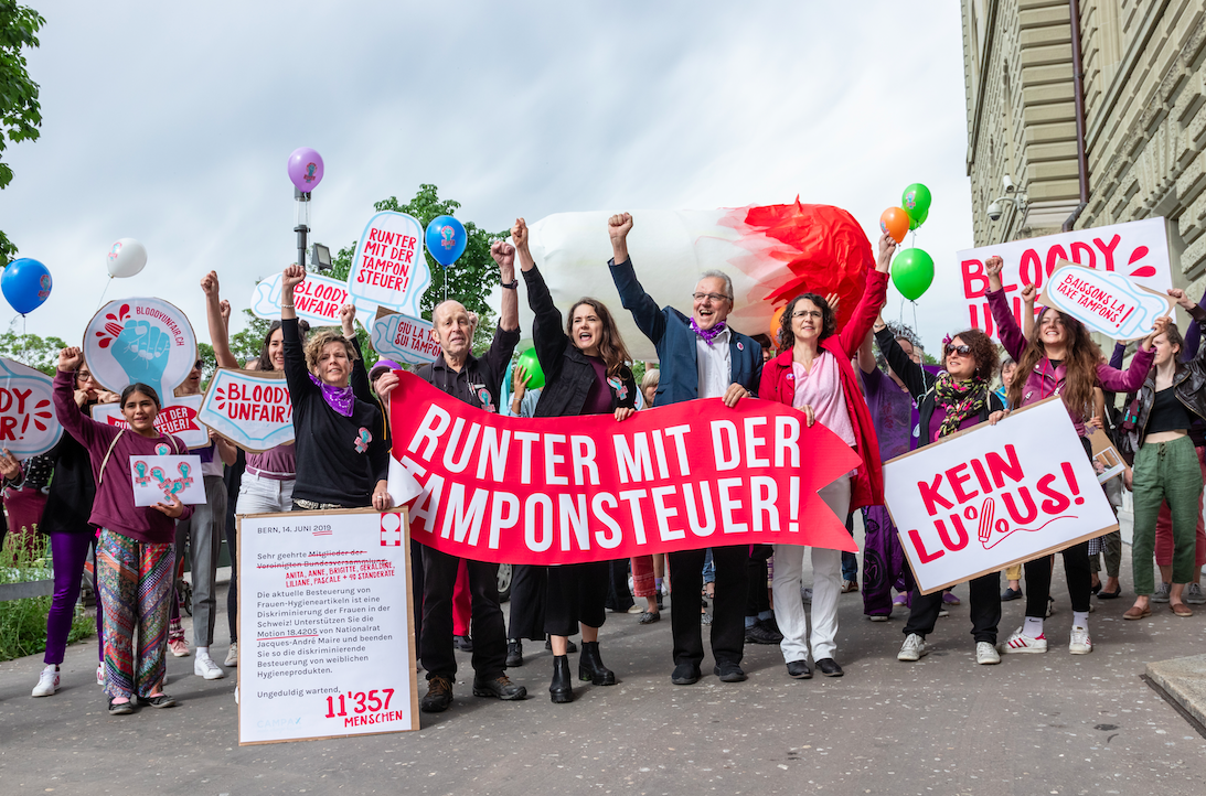 people standing with signs