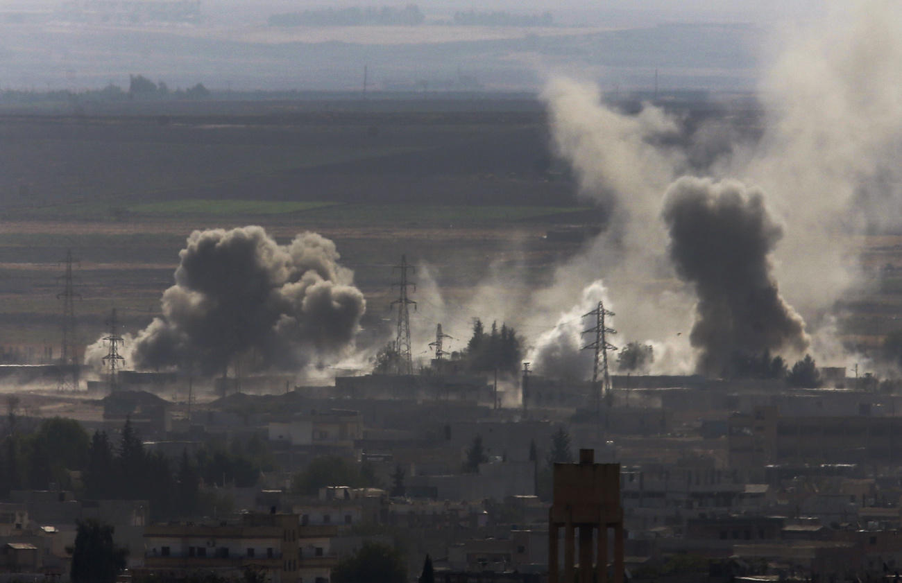 Smoke and dust rise from Turkey bombardment