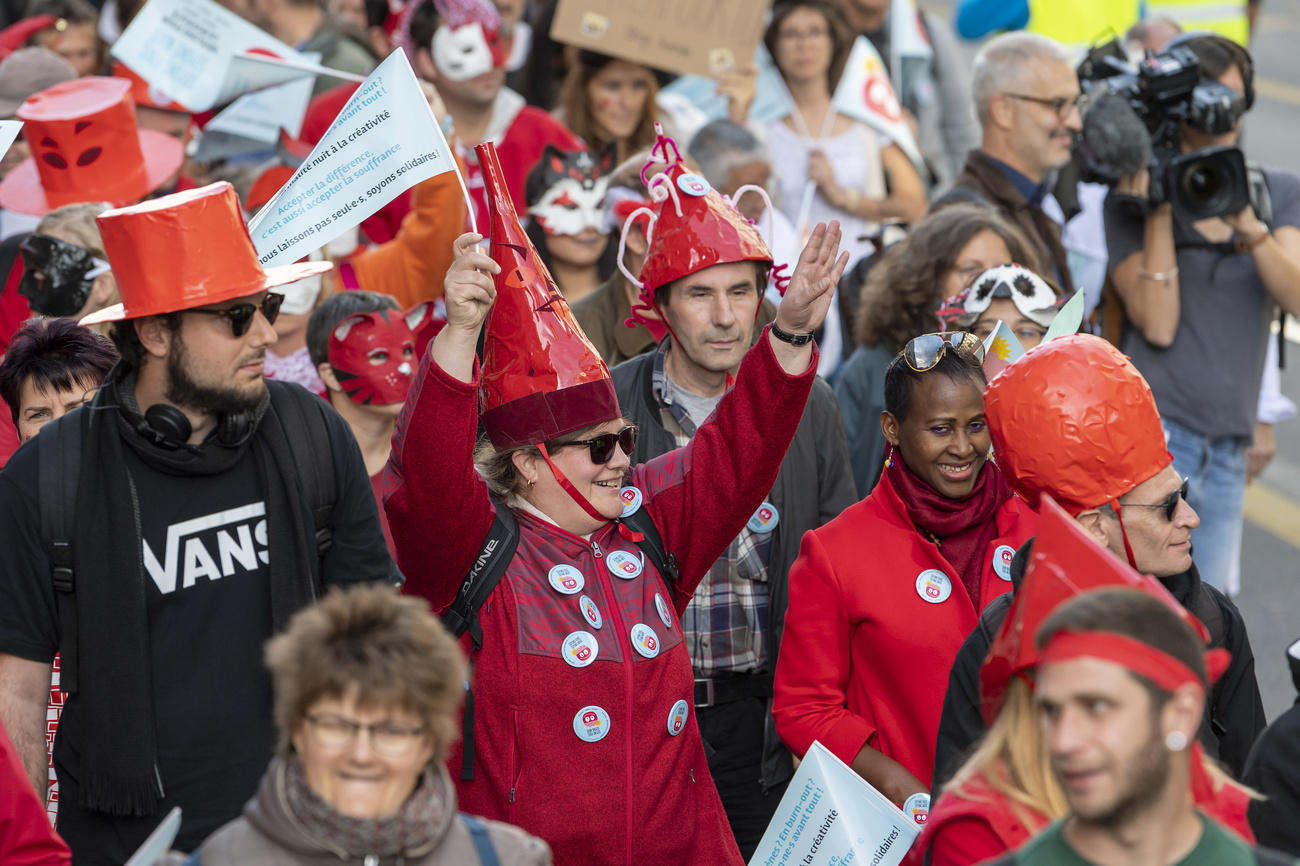 People participate in a Mad Pride, in Geneva