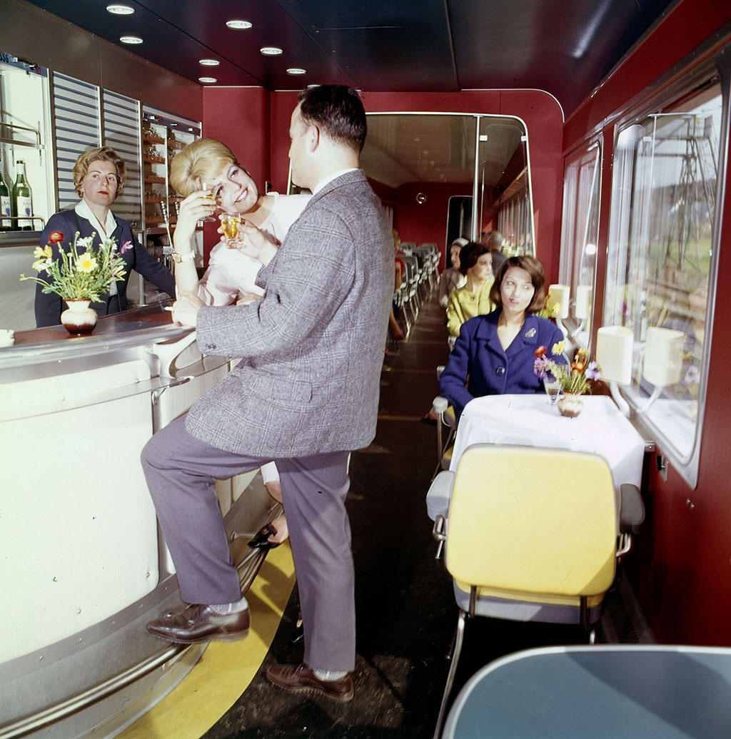 Man and woman in a restaurant carriage of a train.