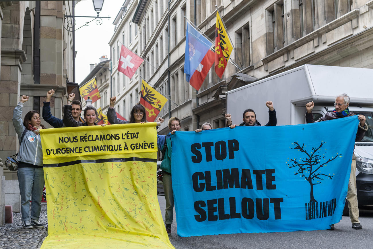 Climate protestors with banners in Geneva
