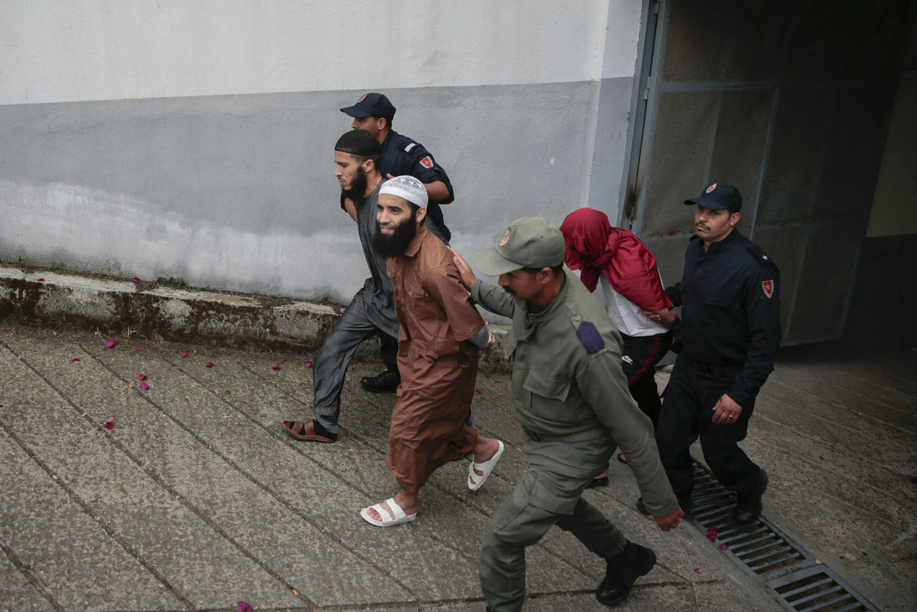 The accused leaving court after an earlier trial session