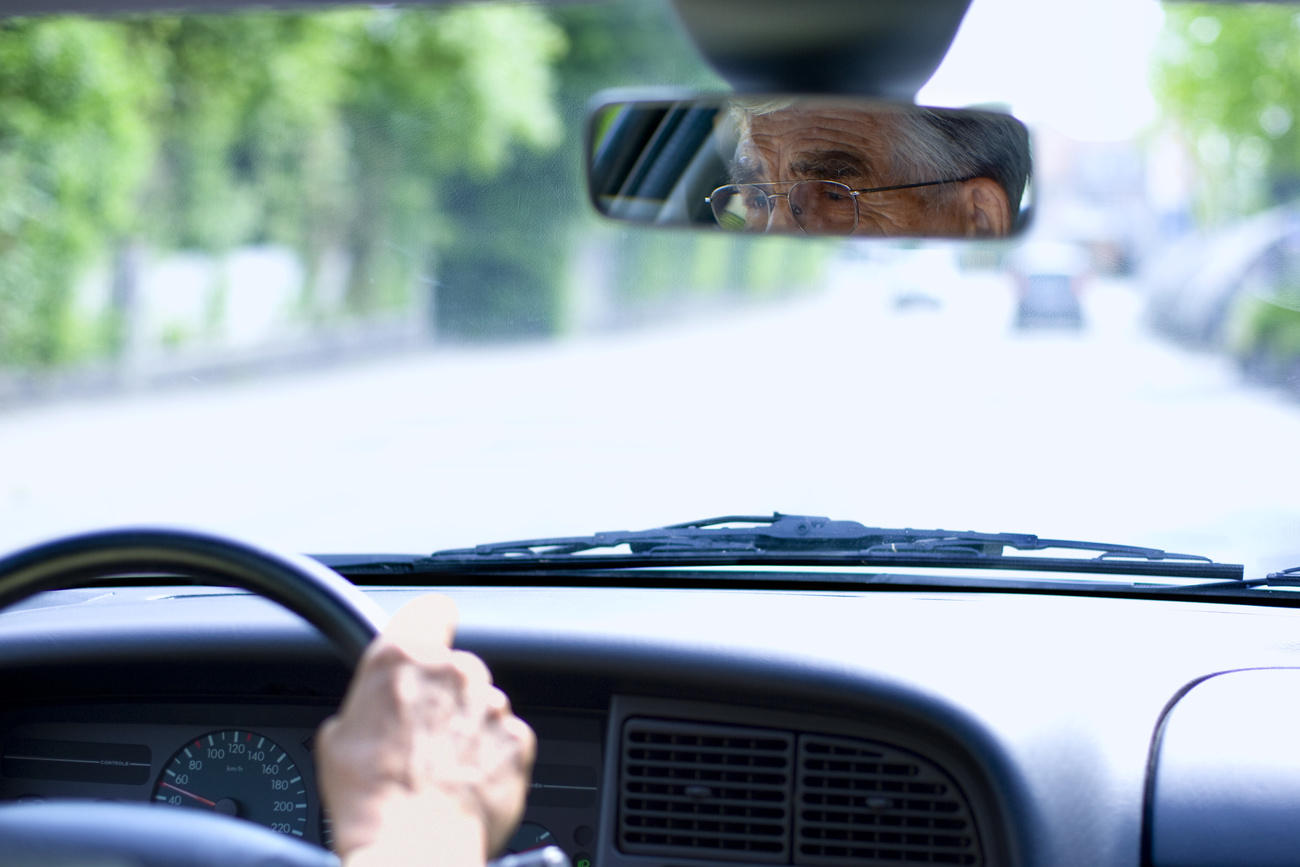 Old Swiss man at the wheel