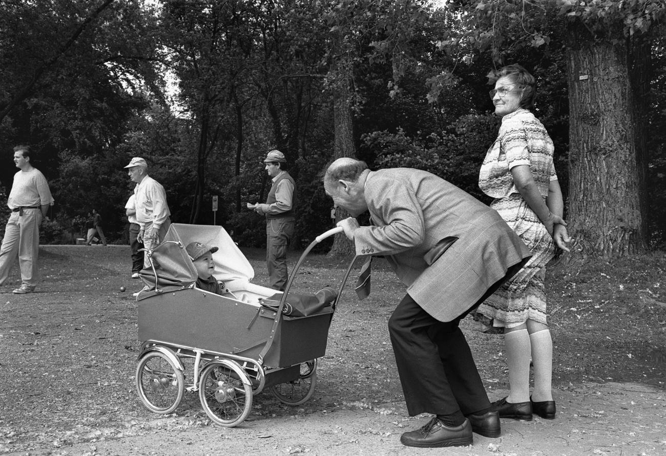 grandparents walking child