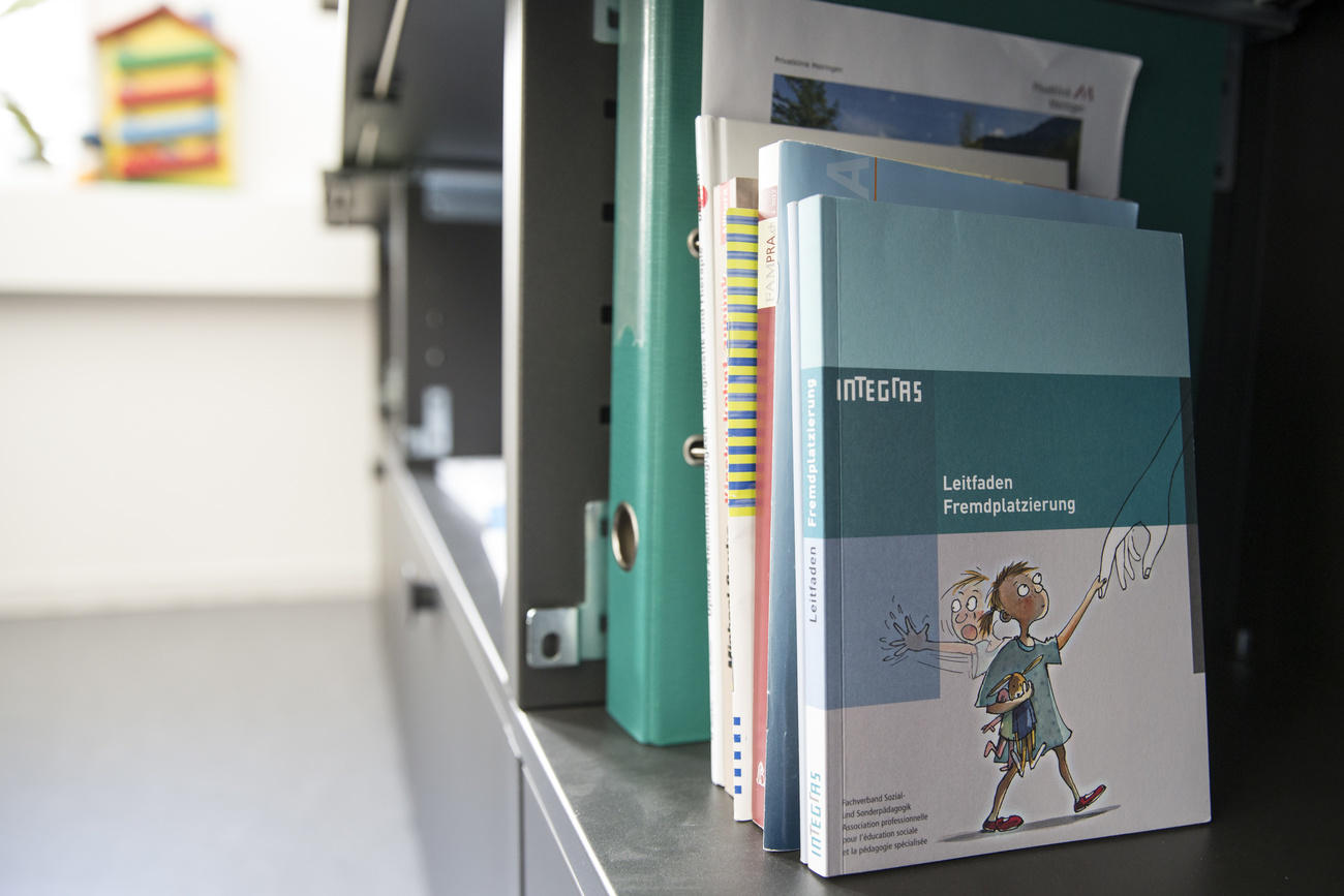 Shelf with books and folders about child protection