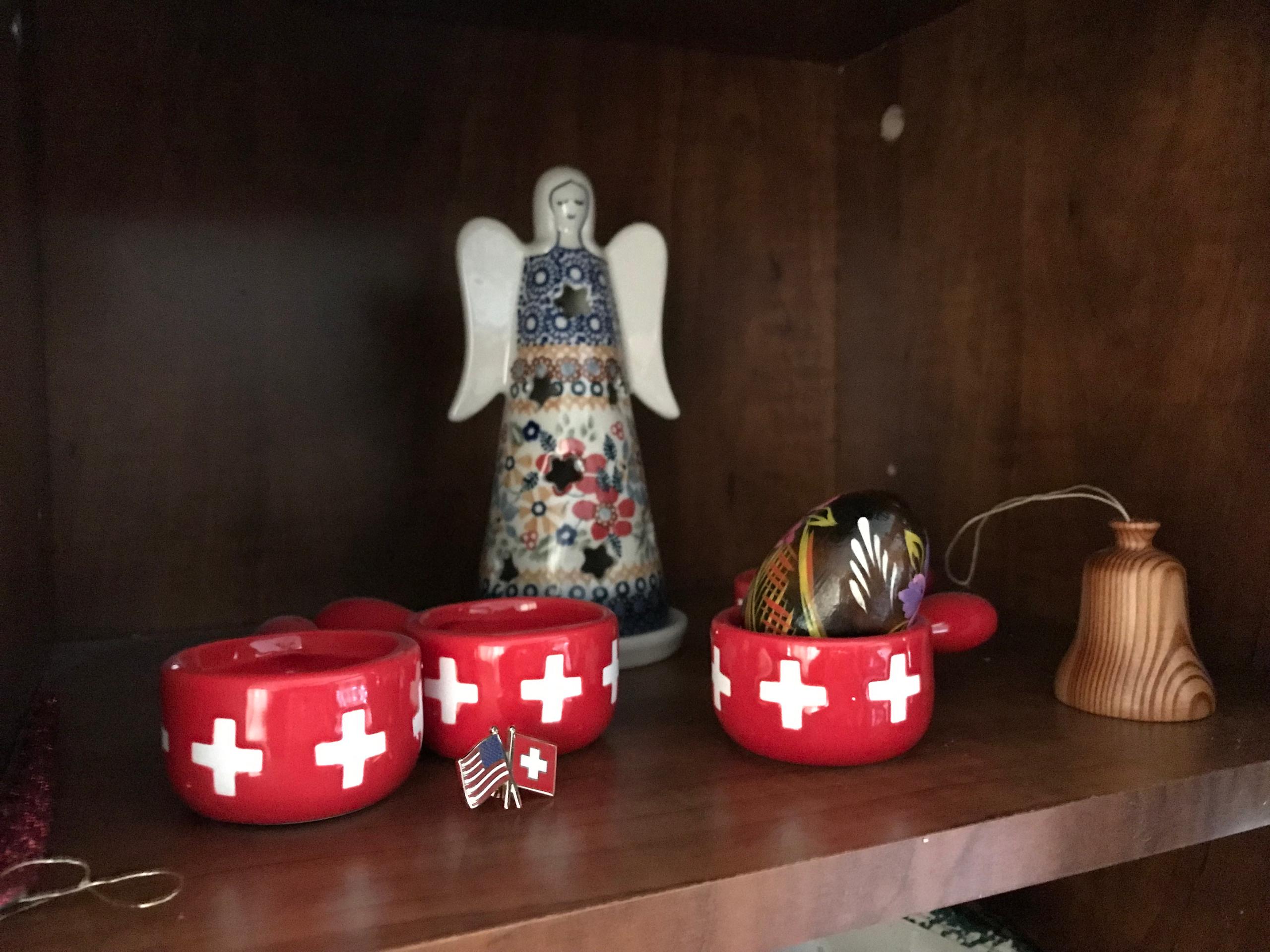 mini fondue pots with Swiss flag plus a pin with Swiss and US flags