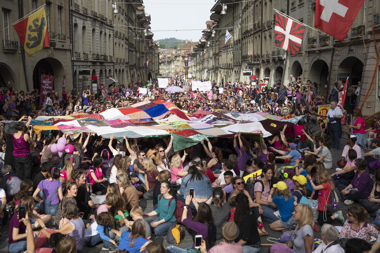 Women filling a street in Bern