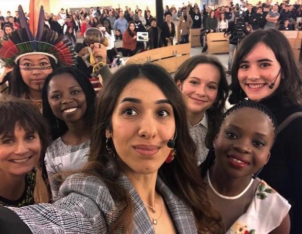 Nadia Murad and other young activists at the Geneva summit