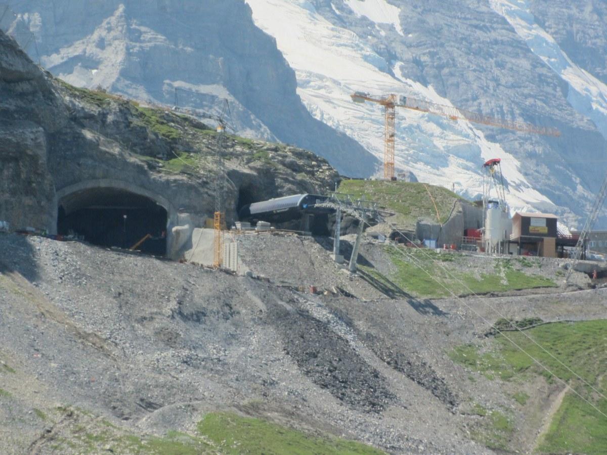Construction site in front of new tunnel in mountains