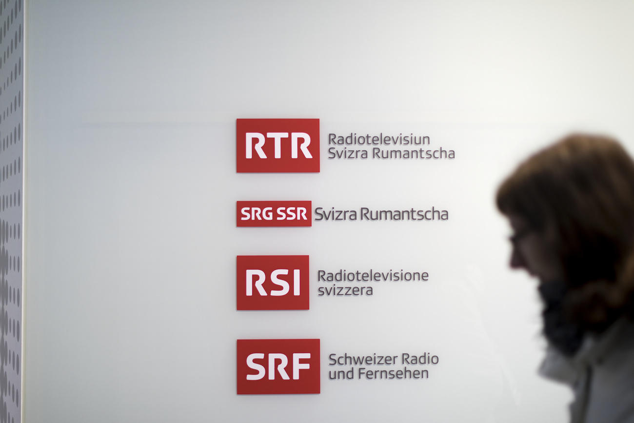 Woman walking past language signs