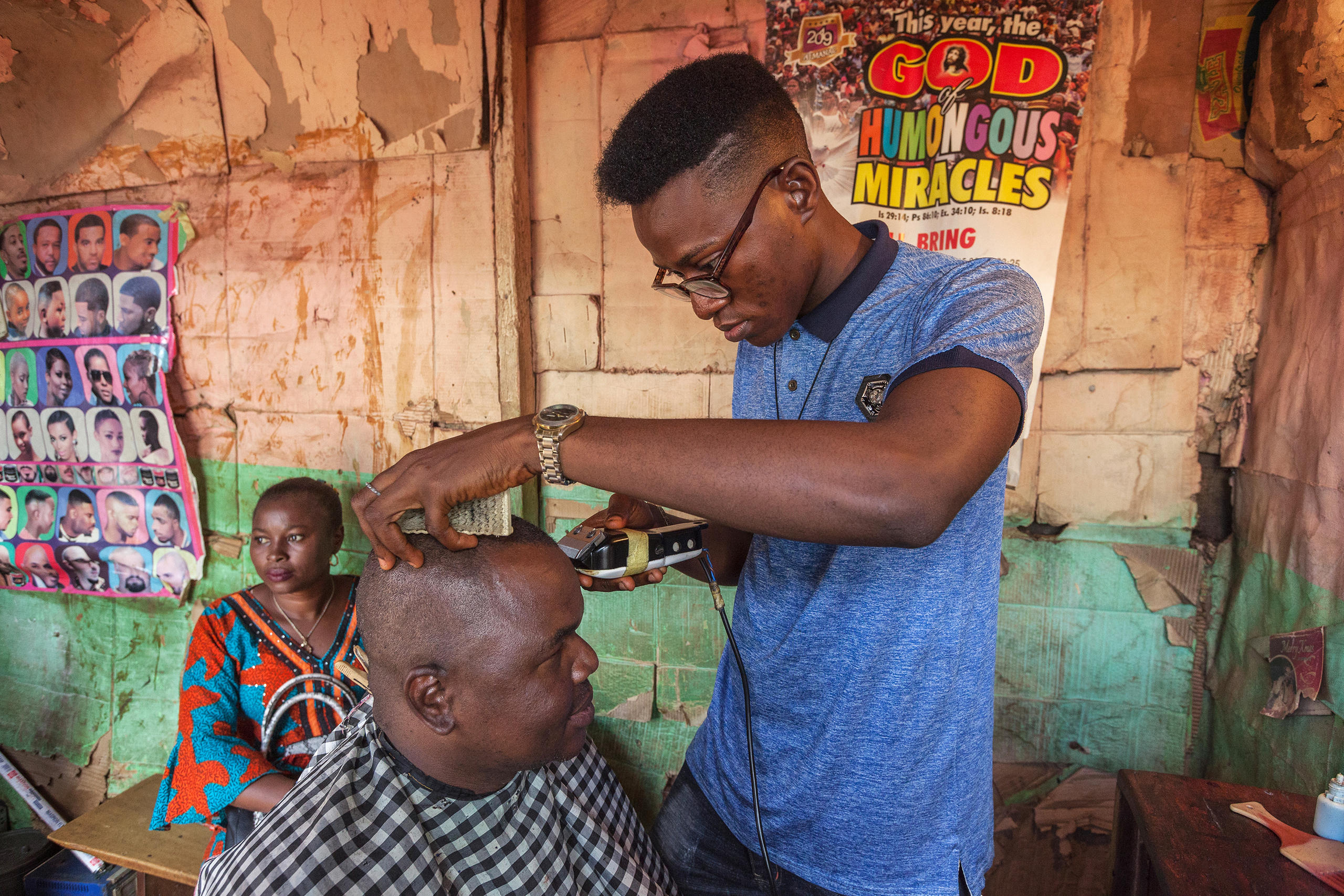 Father Gerald getting a hair cut