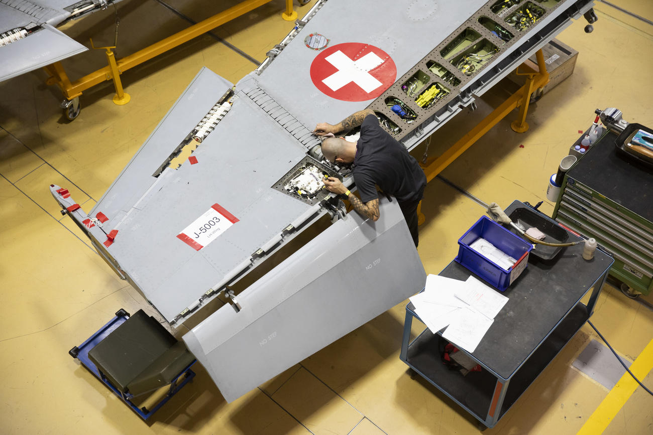 Technician during maintenance work on fighter jet