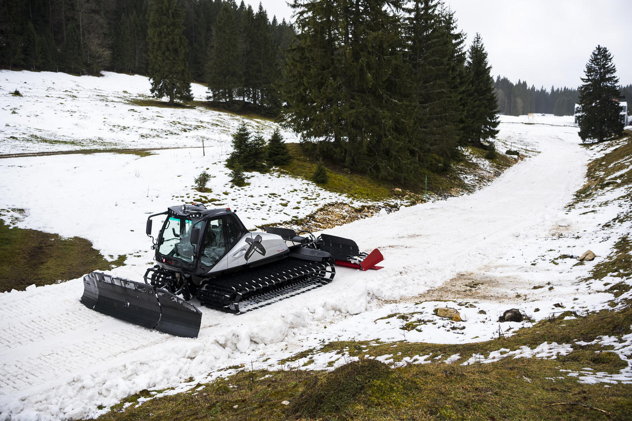 A piste-basher prepares snow on January 4 at Grandes-Roches at Le Brassus