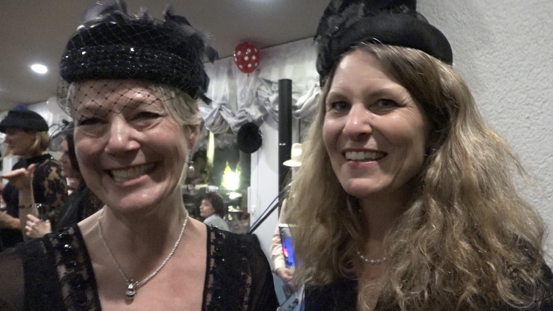 two women dressed in sunday best for festival