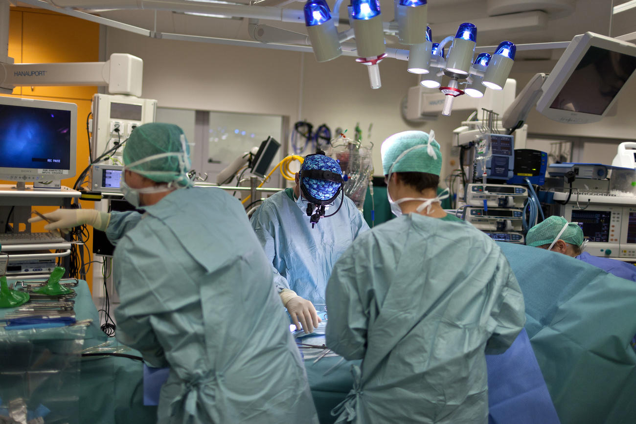 Surgeons working in an operating theatre