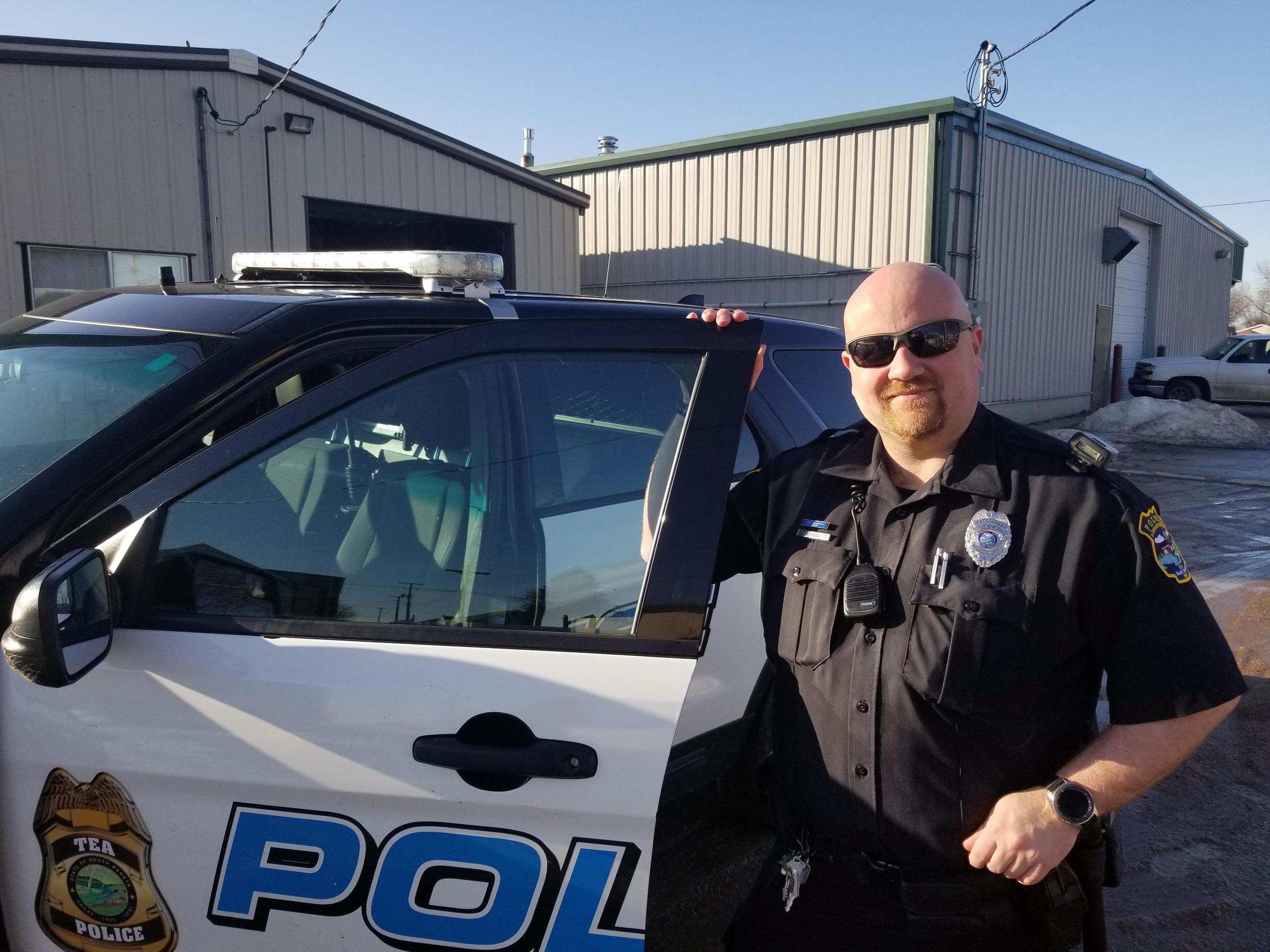 police officer with car