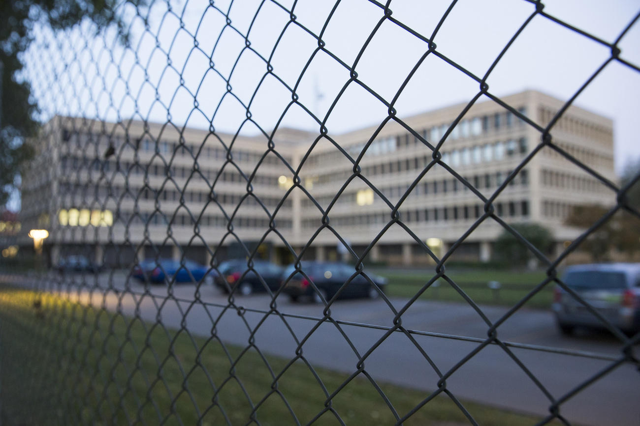 Looking through a fence at a building