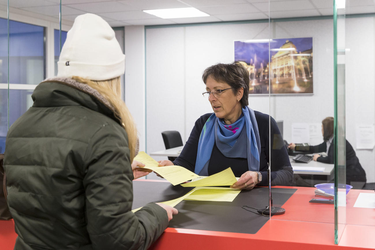 two women looking at paperwork