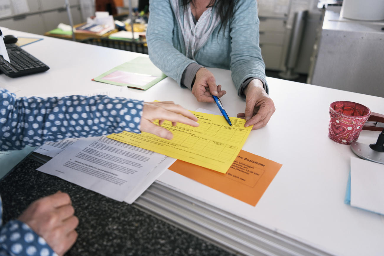 people looking at paperwork