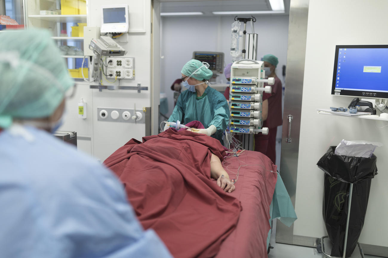 Patient and doctors in hospital