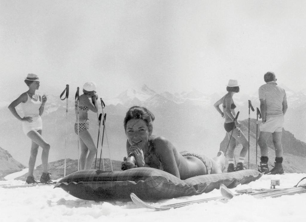 Photoshoot of a woman lying on an inflatable mattress in bikini at Crans Montana