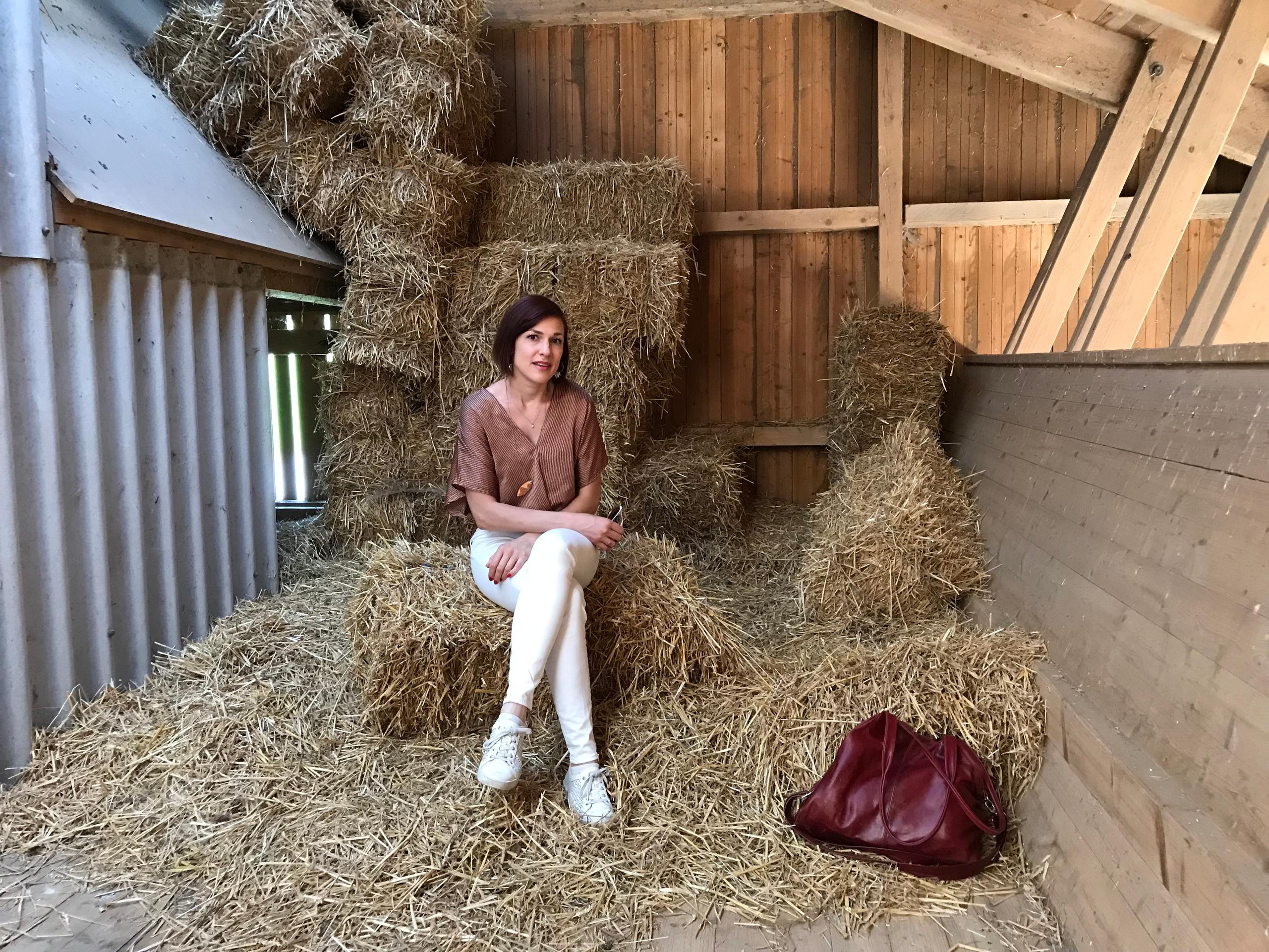 woman sitting on straw