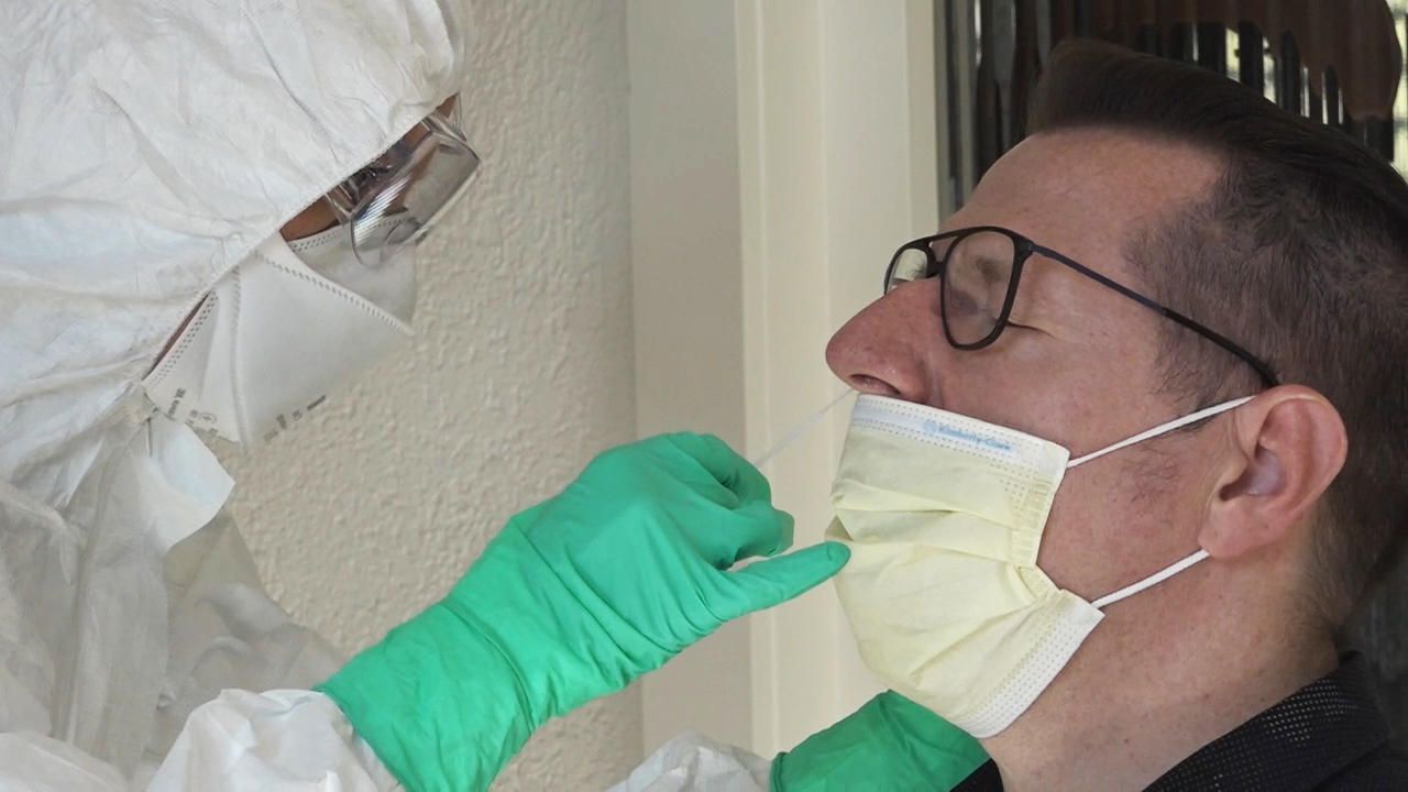 Suspected infected man providing swab